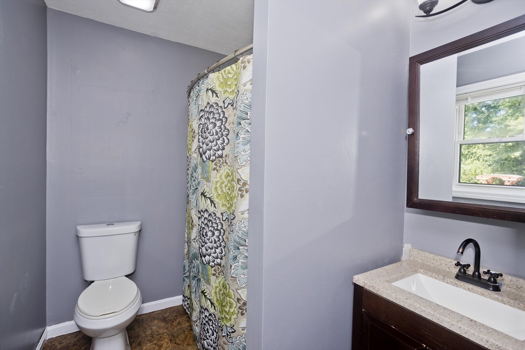5 Michael Drive Enfield, CT 06082 - Photo 27 of 38 a bathroom with a toilet sink and mirror