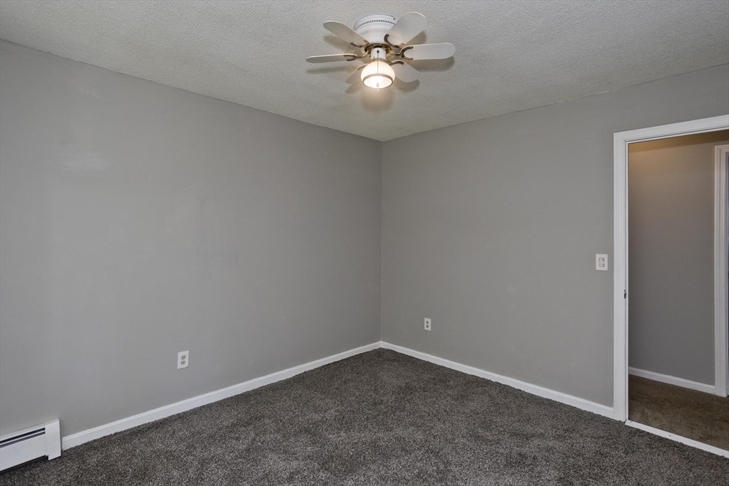 5 Michael Drive Enfield, CT 06082 - Photo 29 of 38 an empty room with a fan and a fan