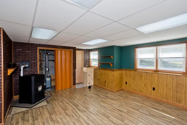a view of a livingroom with wooden floor and a window