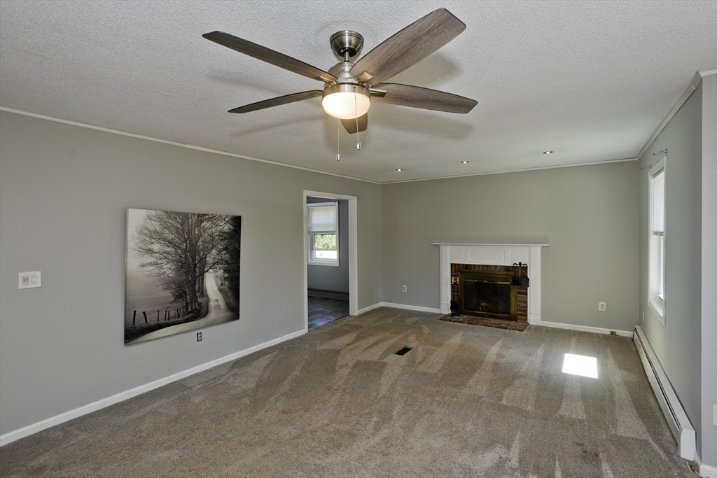 5 Michael Drive Enfield, CT 06082 - Photo 5 of 38 a view of an empty room with a fireplace