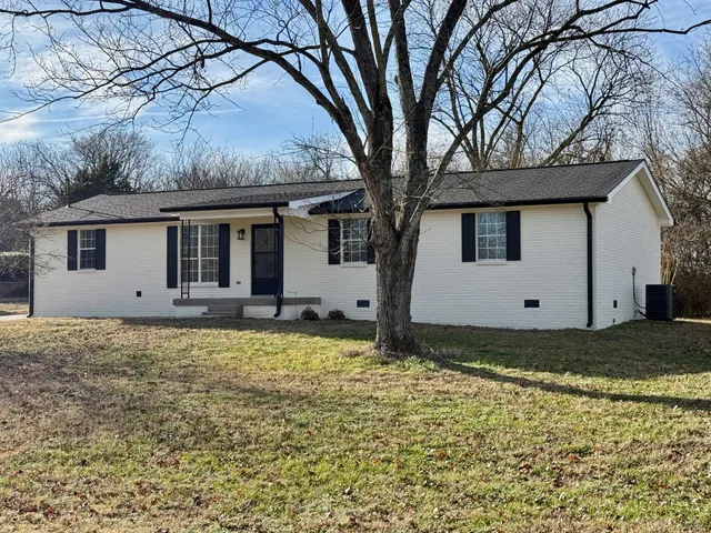 a house with trees in the background