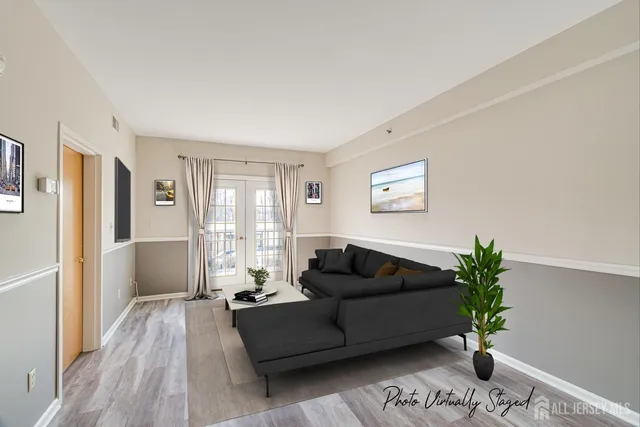 a living room with furniture and a potted plant