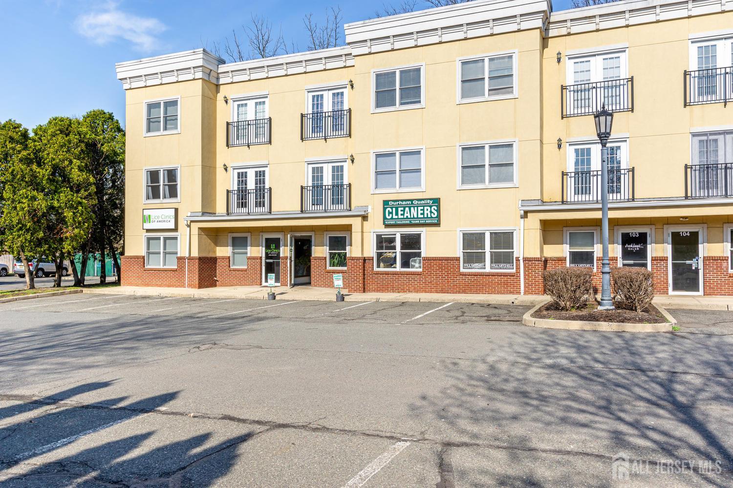 160 Durham Avenue, Unit 305 Metuchen, NJ 08840 - Photo 2 of 39 a front view of a building with many windows