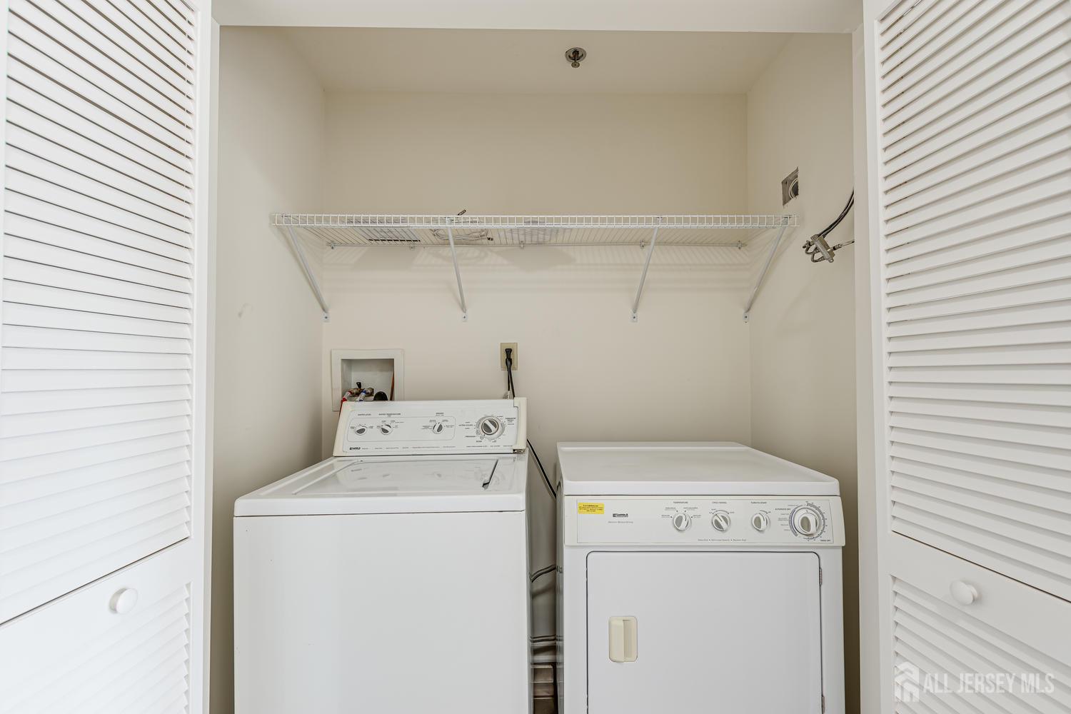 160 Durham Avenue, Unit 305 Metuchen, NJ 08840 - Photo 21 of 39 a utility room with dryer and washer