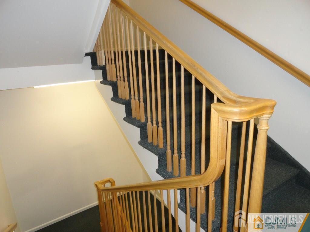 160 Durham Avenue, Unit 305 Metuchen, NJ 08840 - Photo 39 of 39 a view of staircase with railing and a window