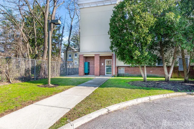 a house that has a tree in front of it