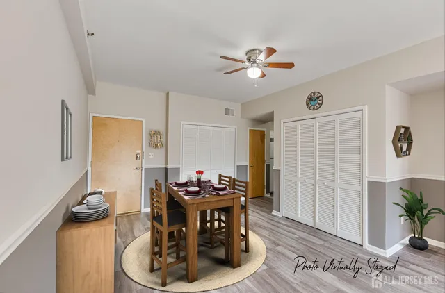 a dining room with furniture and wooden floor