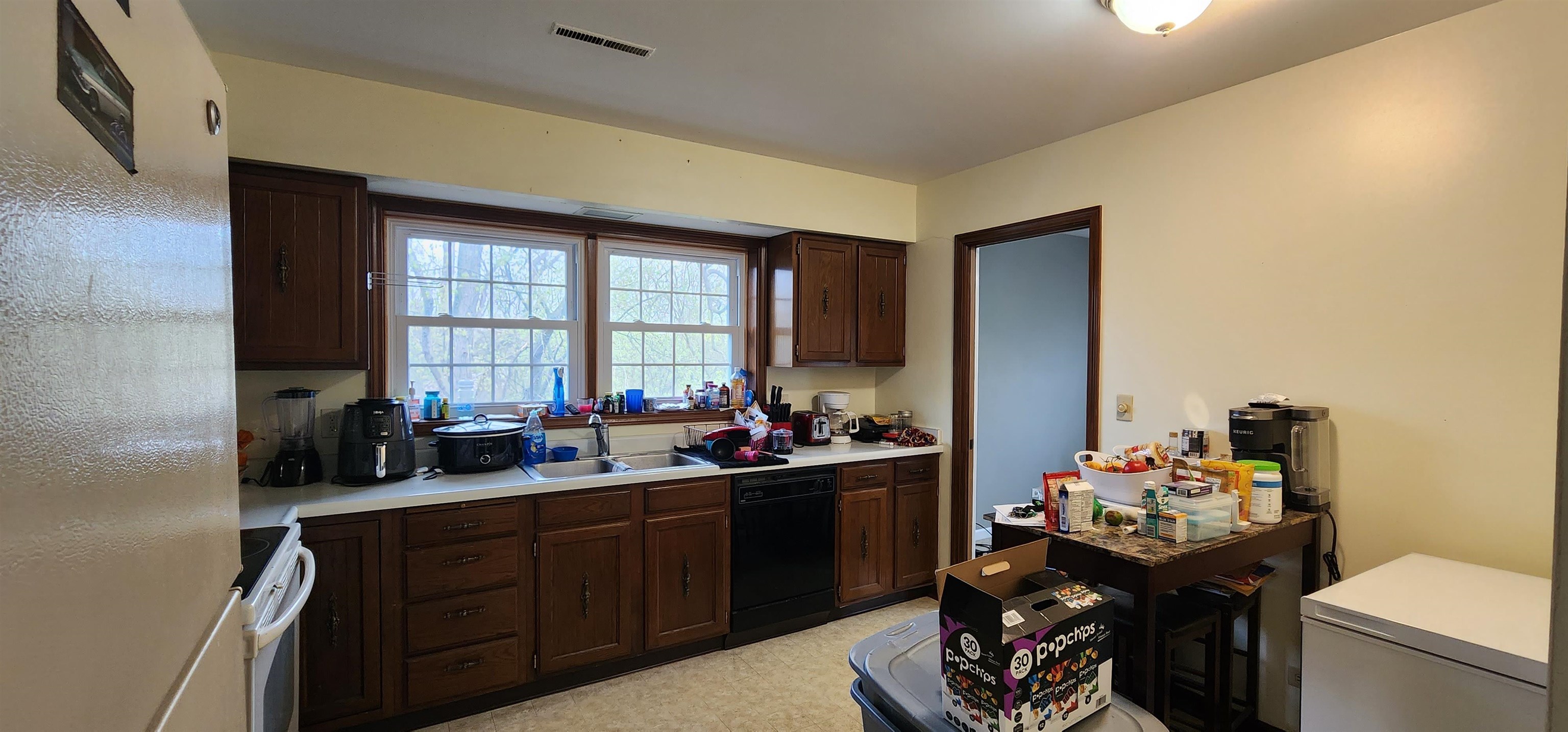 1450 Wing Street Elgin, IL 60123 - Photo 13 of 36 a kitchen with a sink stove and cabinets