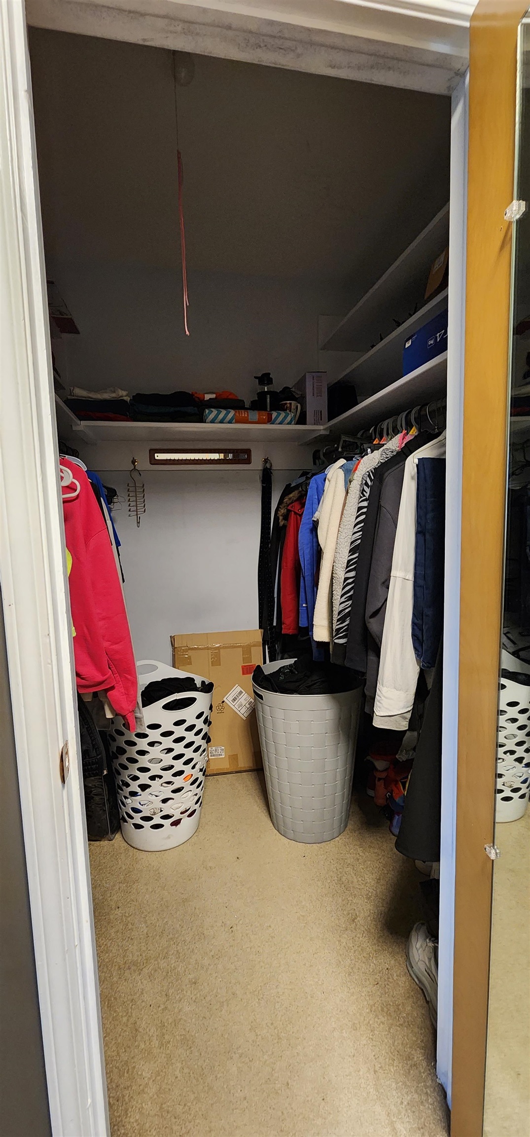 1450 Wing Street Elgin, IL 60123 - Photo 16 of 36 a view of walk in closet with clothes and shoes