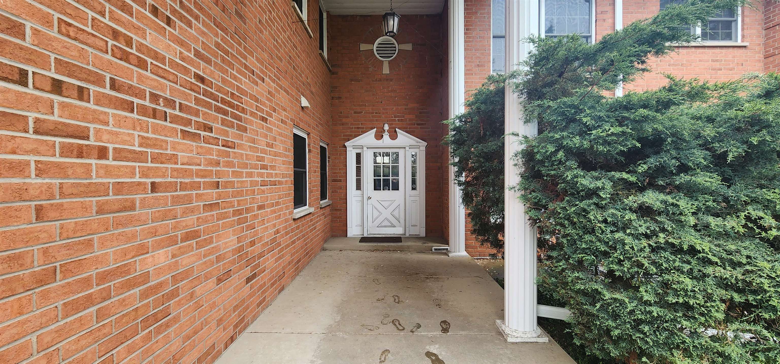 1450 Wing Street Elgin, IL 60123 - Photo 3 of 36 a view of a brick house with a large window