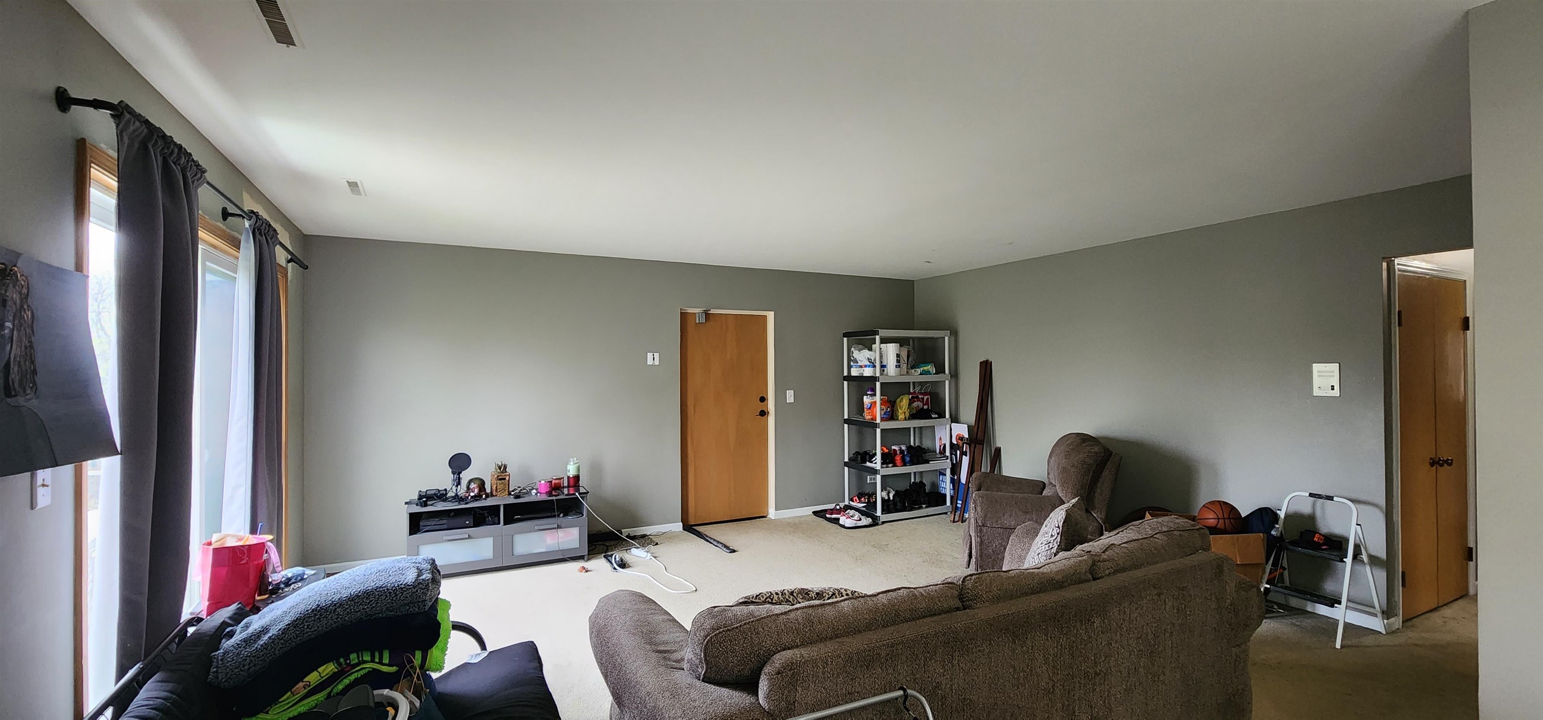 1450 Wing Street Elgin, IL 60123 - Photo 6 of 36 a living room with furniture and a flat screen tv
