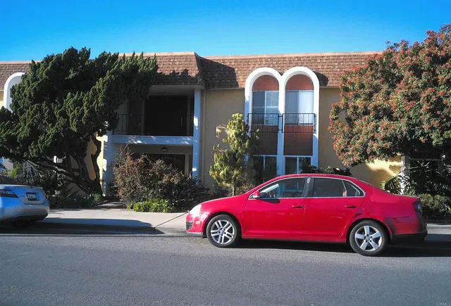 a front view of a house with parking space