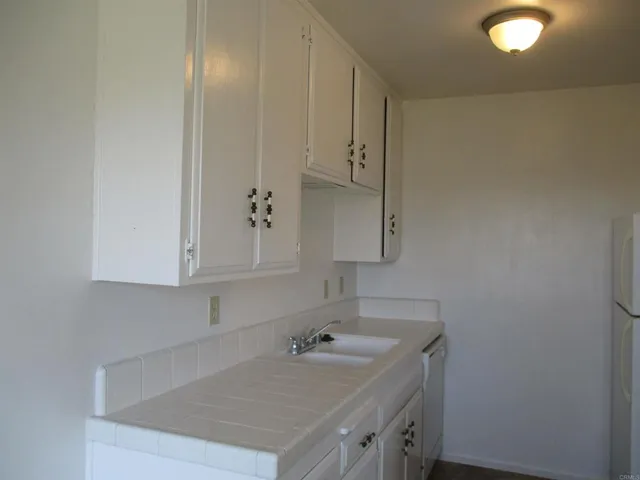 a bathroom with a sink and vanity