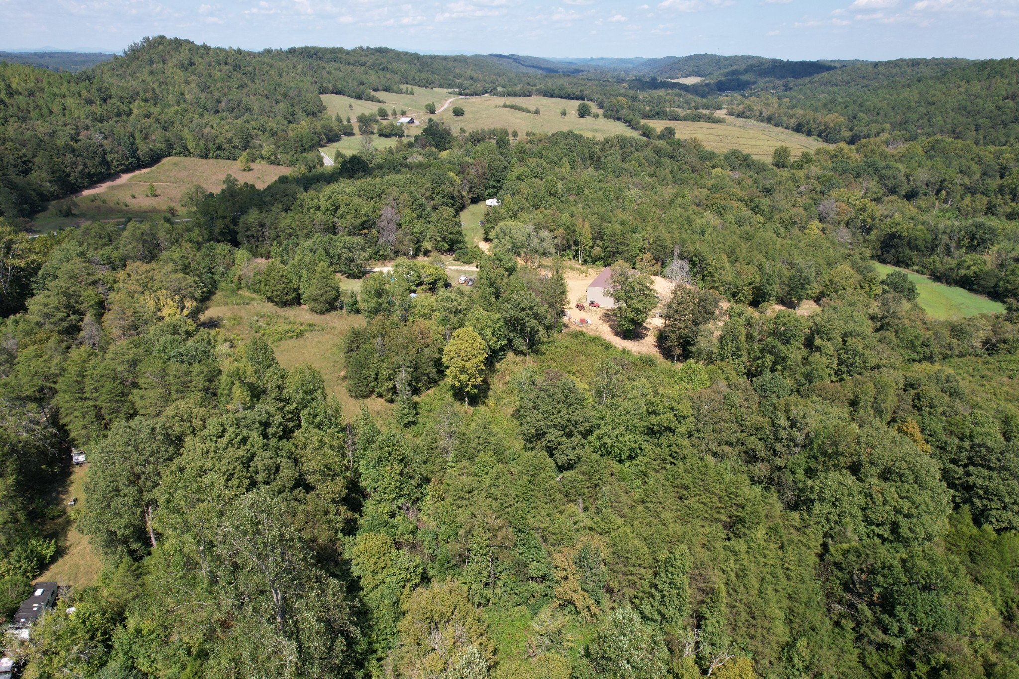 703 Sweetwater Road Philadelphia, TN 37846 - Photo 20 of 34 a view of a lake with a mountain in the background