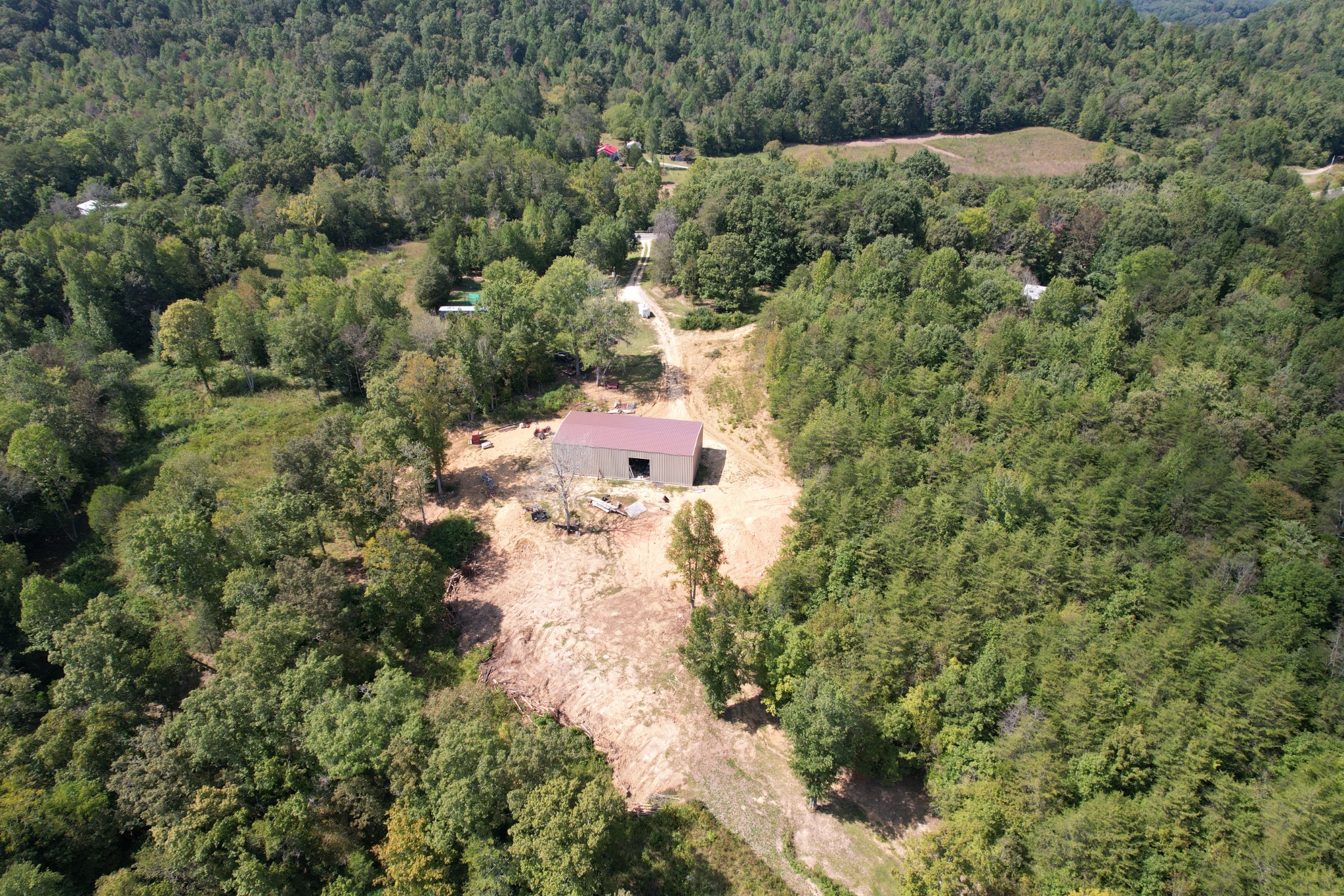 703 Sweetwater Road Philadelphia, TN 37846 - Photo 24 of 34 an aerial view of residential house with outdoor space and trees all around