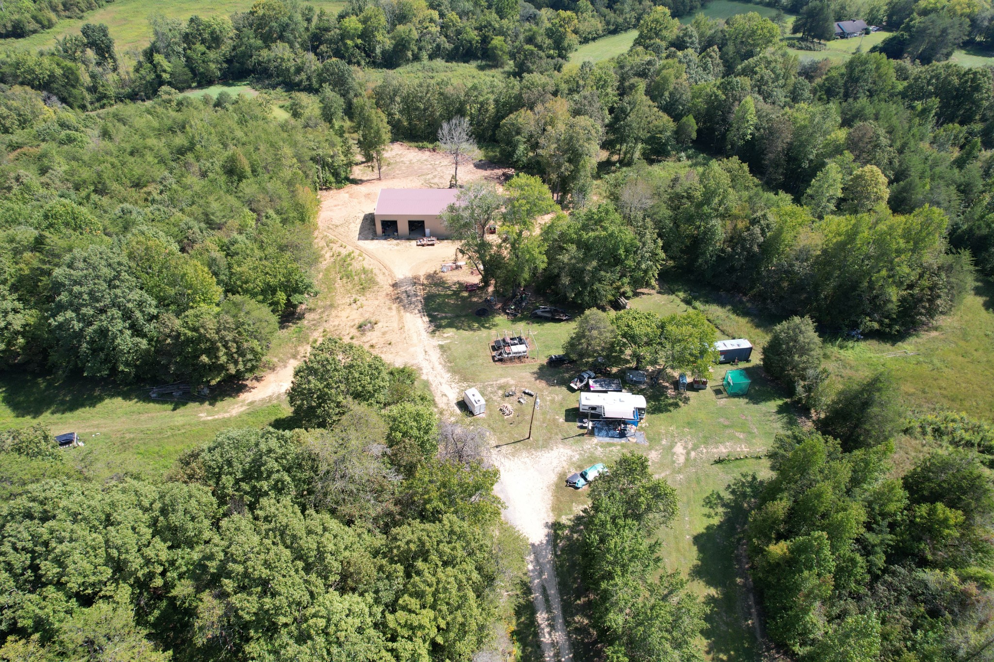 703 Sweetwater Road Philadelphia, TN 37846 - Photo 29 of 34 an aerial view of residential house with outdoor space and trees all around