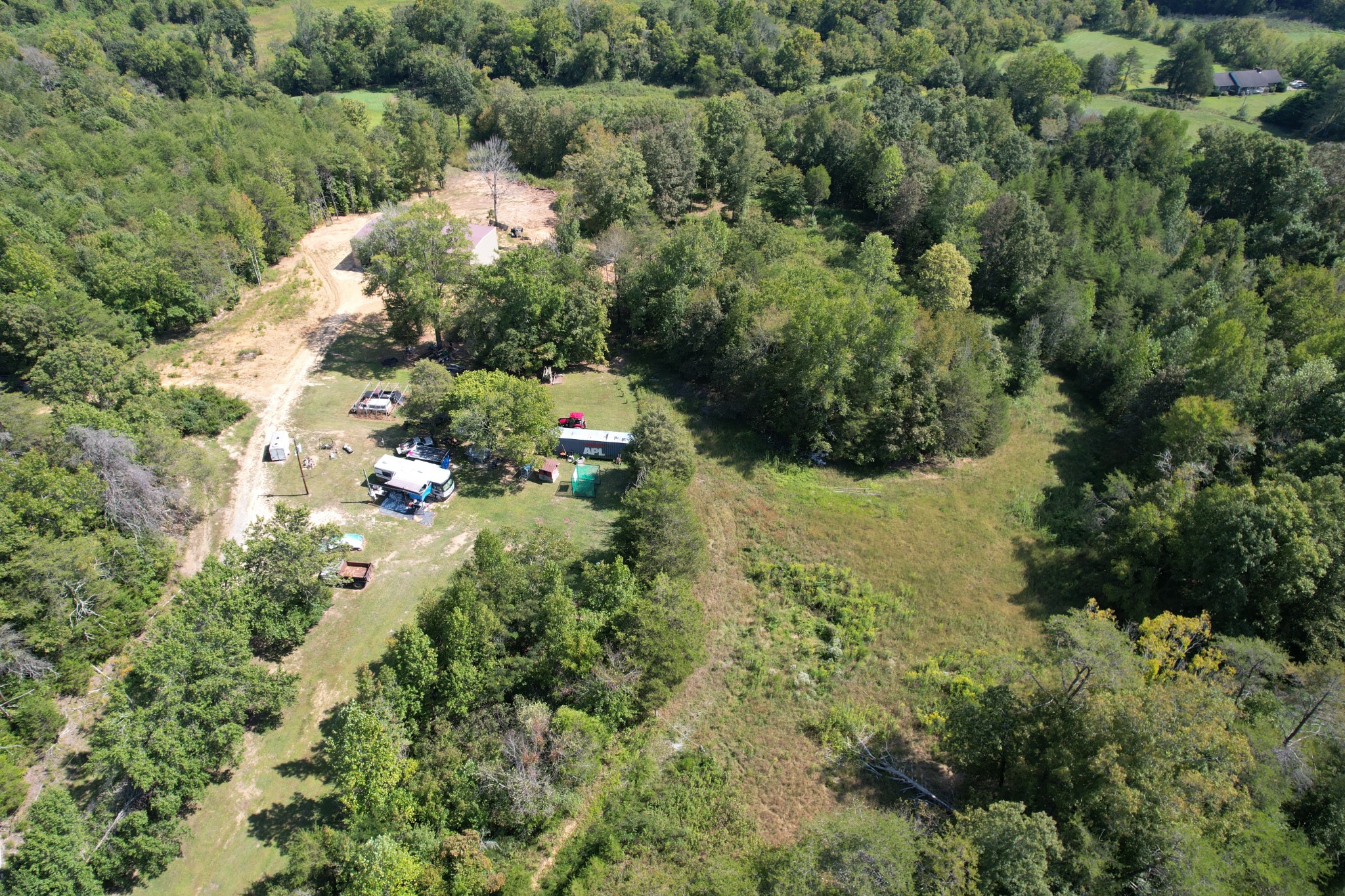 703 Sweetwater Road Philadelphia, TN 37846 - Photo 31 of 34 an aerial view of residential house with outdoor space and trees all around