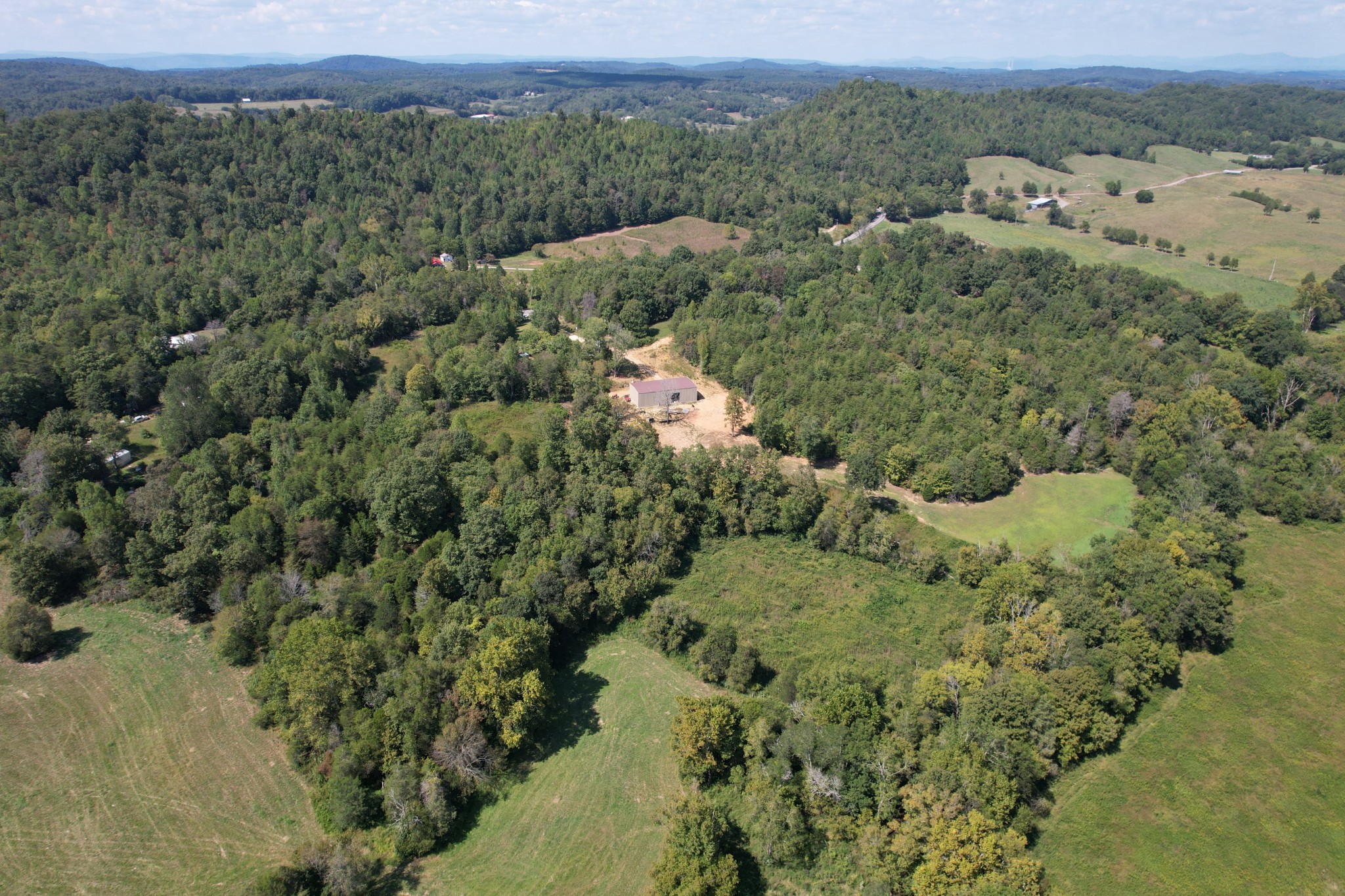 703 Sweetwater Road Philadelphia, TN 37846 - Photo 10 of 34 an aerial view of a houses with a yard
