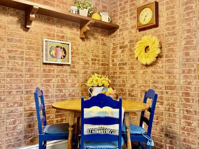 a view of a bathroom with a sink and a mirror