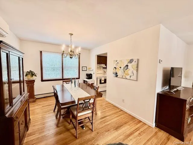 a view of a livingroom with furniture window and wooden floor