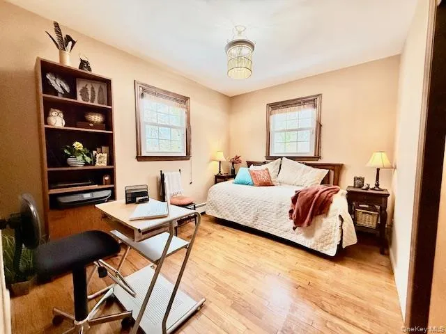 a bedroom with a bed and dresser