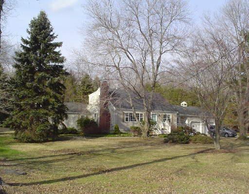 444 Hemlock Road Fairfield, CT 06824 - Photo 1 of 1 a front view of a house with a yard