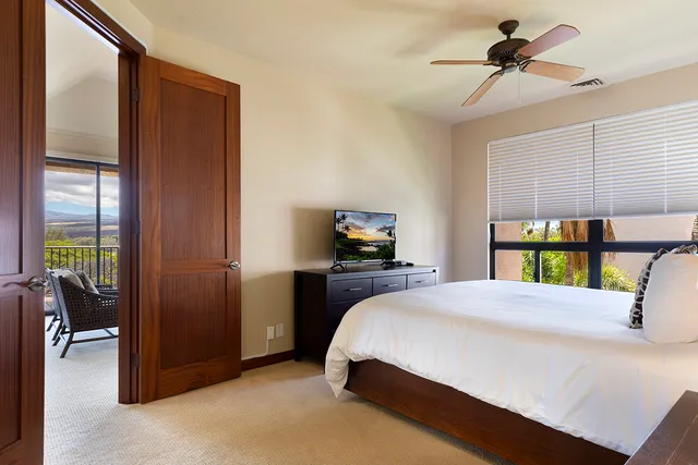 a bedroom with a large bed and furniture