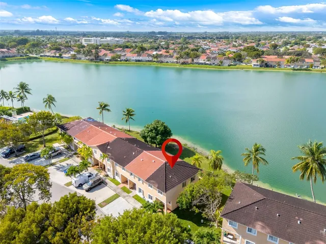 an aerial view of a houses with outdoor space