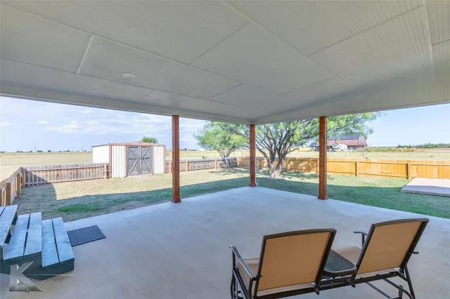 a view of porch with yard and outdoor seating