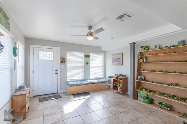 a view of room with cabinet and windows