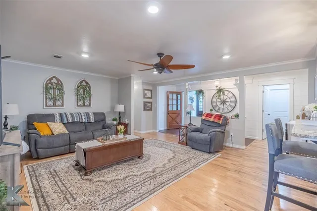 a living room with furniture and a rug