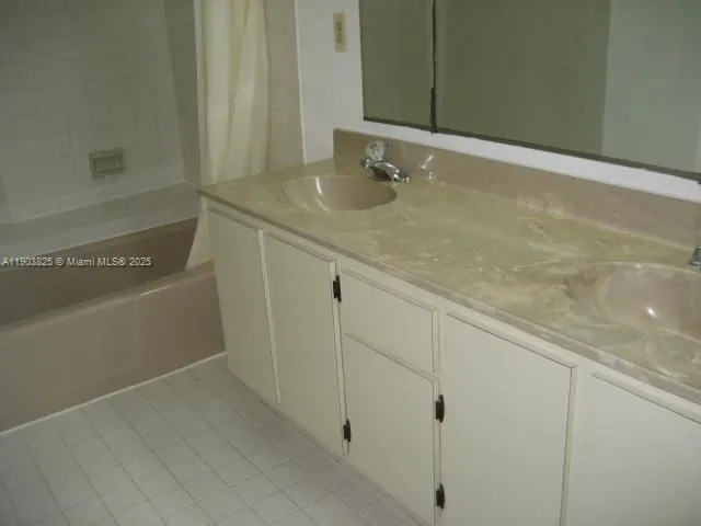 a bathroom with a sink and vanity