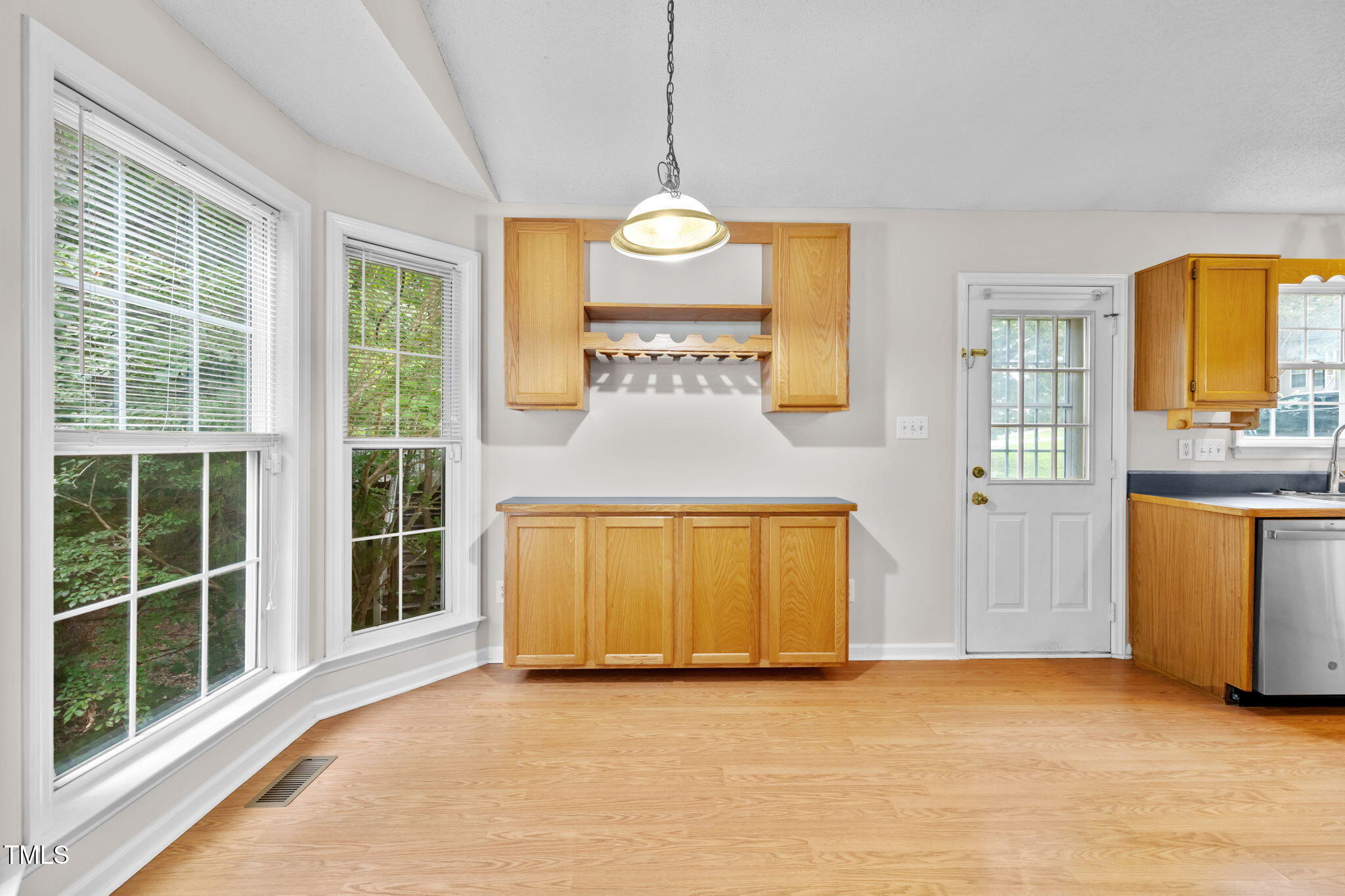 4457 Labrador Drive Raleigh, NC 27616 - Photo 8 of 27 a view of a kitchen with a tub and windows