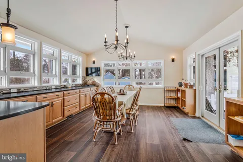 a bedroom with bed and a chandelier