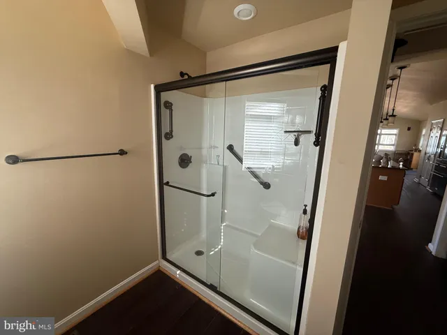 a bathroom with a sink toilet and window