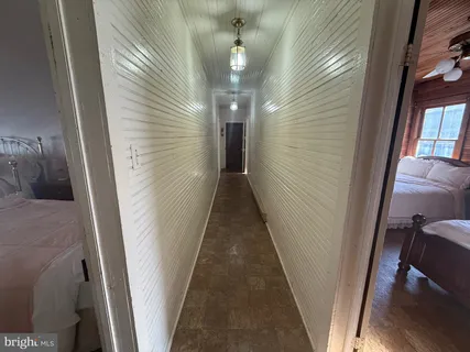 a view of a livingroom with furniture and chandelier