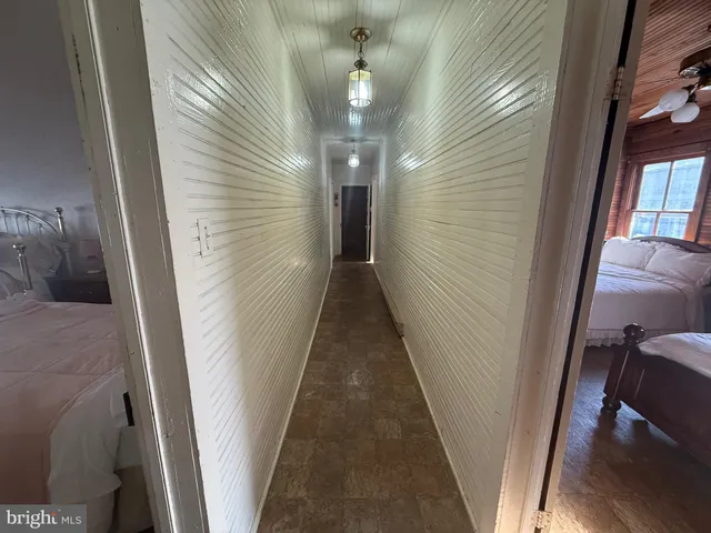 a view of a livingroom with furniture and chandelier