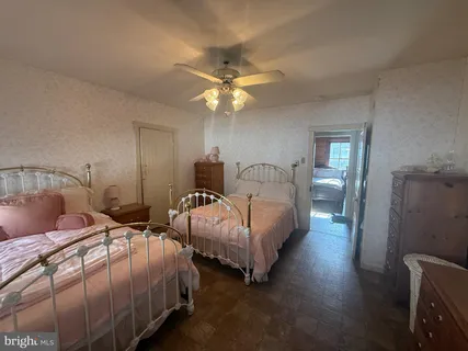 a bed room with a bed and a chandelier