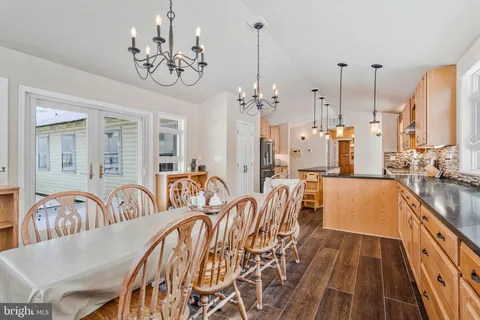 a bed room with a bed and a chandelier