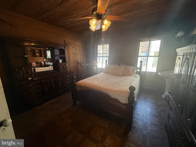 a view of a dining room with furniture wooden floor and chandelier