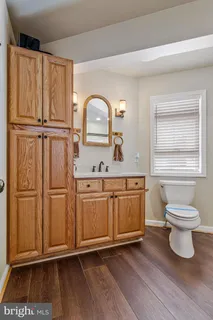 a picture of a bench in front of a window