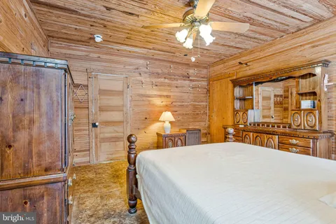 a bedroom with a bed and a cabinets