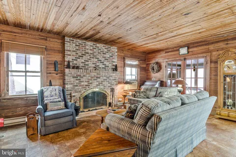a view of a house with snow on the road