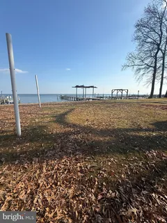 a living room with furniture and a lamp