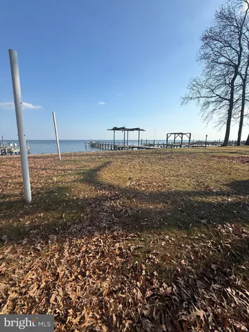a living room with furniture and a lamp