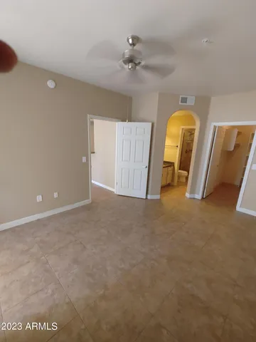 a view of a room with window and hardwood floor