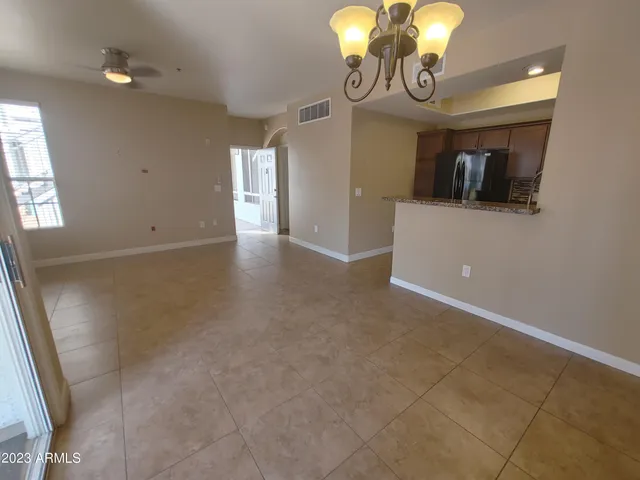 a kitchen with a refrigerator and microwave