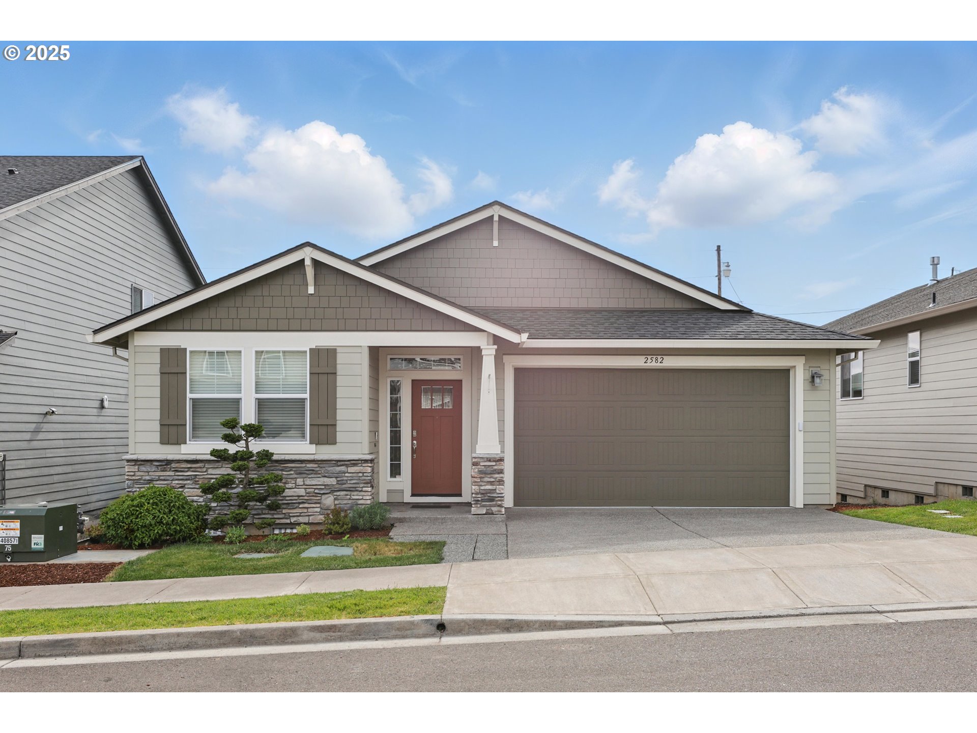 a front view of a house with a yard