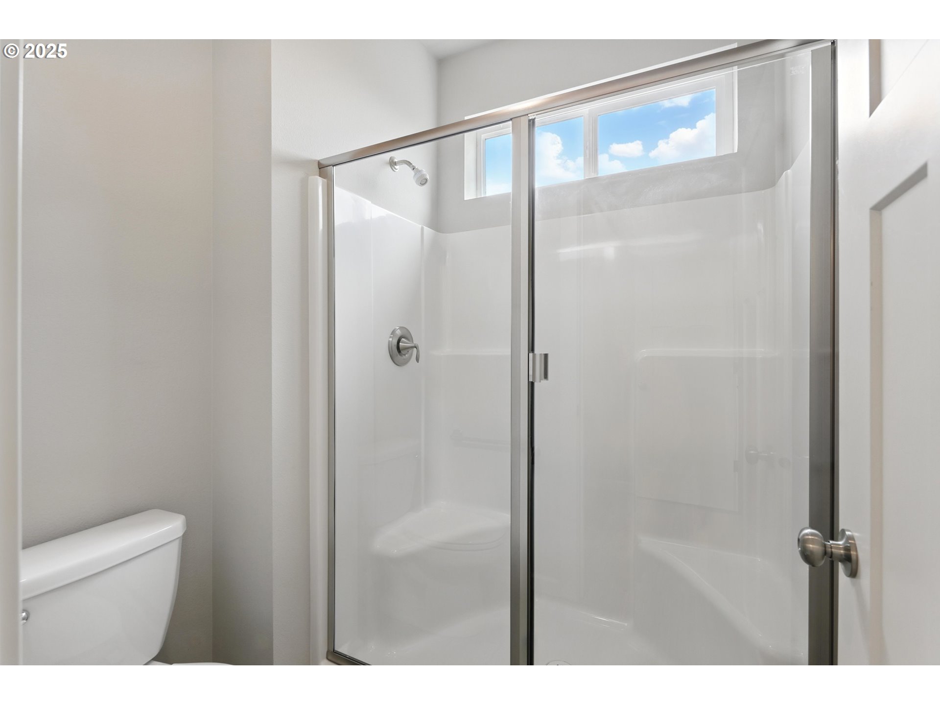 2582 Southwest Thomas Way Gresham, OR 97080 - Photo 23 of 36 a bathroom with a glass shower door