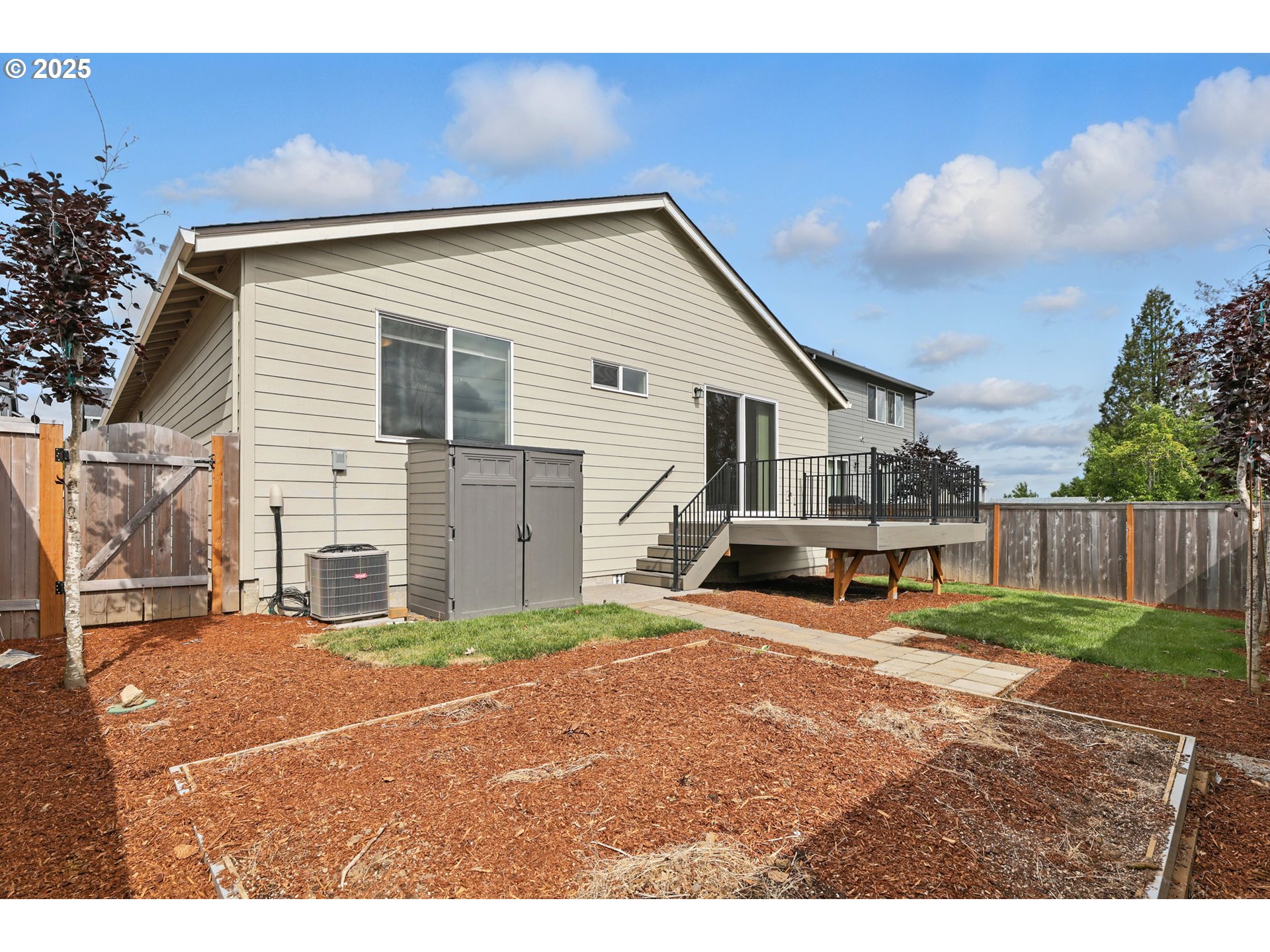 2582 Southwest Thomas Way Gresham, OR 97080 - Photo 35 of 36 a view of a house with backyard and a tree